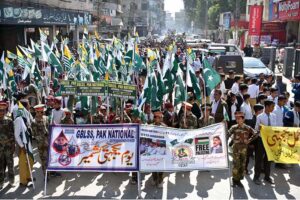 Students holding banners and raising slogans during march to mark Kashmir Solidarity Day reaffirming their support for the cause on Risala Road.