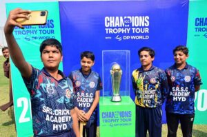 DC Hyderabad Zain-ul-Abideen along with others posing photograph with ICC Champions Trophy at Niaz Stadium during ICC Men’s Champions Trophy 2025 Trophy Tour.