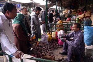 A vendor displays a variety of fruits, commonly used in fruit salads, a staple on the menu for breaking fast during the holy month of Ramdan, attracting customers at H-9 Weekly Bazar.