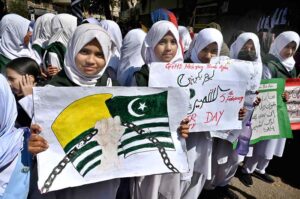 Students holding banners and raising slogans during march to mark Kashmir Solidarity Day reaffirming their support for the cause on Risala Road.