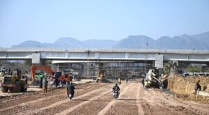 Labourers busy in construction work of F-8 Exchange Chowk Interchange project during development work in Federal Capital.