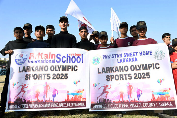Players of Pakistan Sweet Home attending the opening ceremony of Larkana Sports Festival 2025 at Municipal Stadium