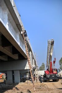 Labourers busy in construction work of F-8 Exchange Chowk Interchange project during development work in Federal Capital.
