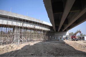 Labourers busy in construction work of F-8 Exchange Chowk Interchange project during development work in Federal Capital.
