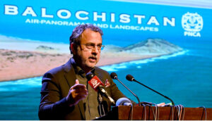 Federal Minister of Energy Sardar Awais Ahmed Khan Leghari addresses the audience at the launch of a coffee table book and large-format photo exhibition in the federal capital