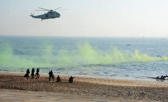 Pakistan Navy’s SEAL team conduct counter terrorism demo during the Pakistan Navy’s 9th Multinational Exercise AMAN25, under the slogan ‘Together for Peace