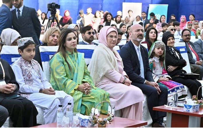 The First Lady of Turkiye, Mrs. Emine Erdogan watching students perform tableau during her visit to the Maarif School in Sector H-8