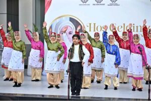 Students performing in tableau on stage at Maarif School in Sector H-8
