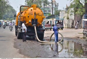 WASA workers cleaning the sewerage line on Empress Road after the rains in the provincial capital.