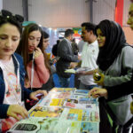 Women inquiring about the products being offered at different stalls during the third day of Pakistan Travel Mart at the Expo Center