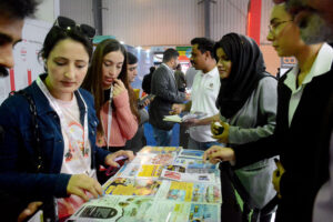 Women inquiring about the products being offered at different stalls during the third day of Pakistan Travel Mart at the Expo Center