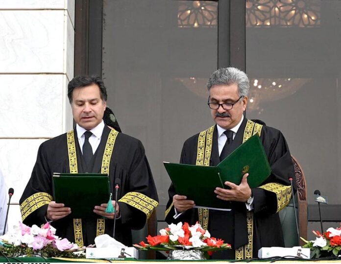 Hon'ble Mr. Justice Yahya Afridi, Chief Justice of Pakistan administering the oath of office to Mr. Justice Miangul Hassan Aurangzeb, Judge, Islamabad High Court as Acting Judge of the Supreme Court of Pakistan