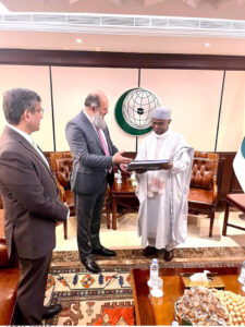 Federal Minister Jam Kamal Khan presents a book showcasing Pakistan's natural beauty to OIC Secretary-General Hissein Brahim Taha during their meeting in Jeddah, emphasizing Pakistan's commitment to strengthening economic and trade ties within the OIC in federal capital