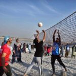 Player in action in volleyball match during Sindh Darya Games 2025 organized by Sindh Sports and Youth Affairs Department at bank of Indus River