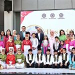 The First Lady of Turkiye, Mrs. Emine Erdogan, pose for a group photograph with students who performed a tableau during her visit to the Maarif School in Sector H-8