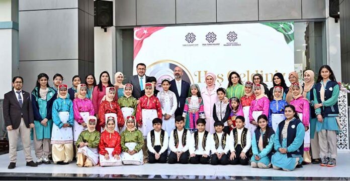 The First Lady of Turkiye, Mrs. Emine Erdogan, pose for a group photograph with students who performed a tableau during her visit to the Maarif School in Sector H-8