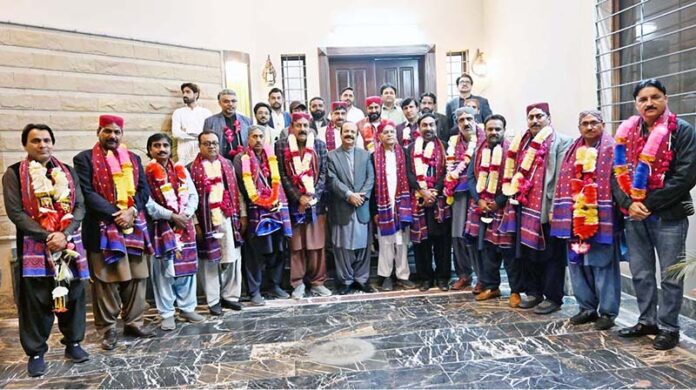 A group photo of newly elected officials of the Arts Council of Larkana with Special Assistant to Chief Minister Sindh, Khair Muhammad Sheikh, former DIG Riaz Soomro during ceremony at Ayaz Soomro House