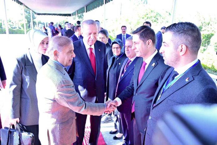 President of Turkiye H.E. Recep Tayyip Erdogan introduces members of the Turkish entourage to Prime Minister Muhammad Shehbaz Sharif at PM House
