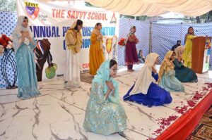 Students performing a tableau at the Annual Prize Distribution Ceremony of the Savvy School Nishatabad.