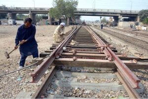 Railway workers are busy working the Kanta line track to divert trains from one track to another.