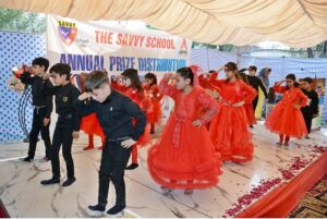 Students performing a tableau at the Annual Prize Distribution Ceremony of the Savvy School Nishatabad.