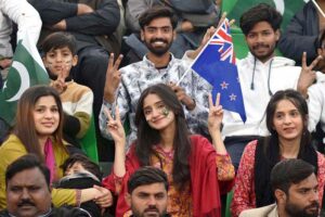 Spectators enjoy while watching first match of the Tri-Nation Series played between Pakistan and New Zealand cricket teams at Gaddafi Stadium