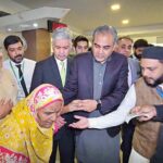 Interior Minister Mohsin Naqvi interacting with citizens at NADRA Mega Center in Nazimabad