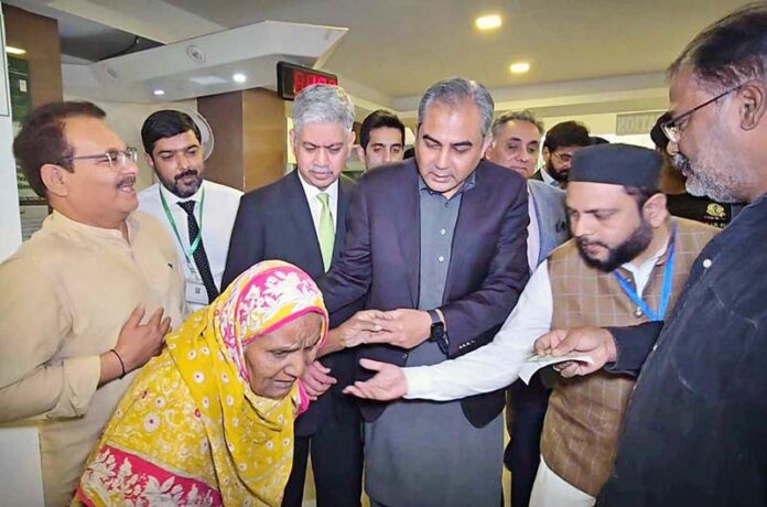 Interior Minister Mohsin Naqvi interacting with citizens at NADRA Mega Center in Nazimabad