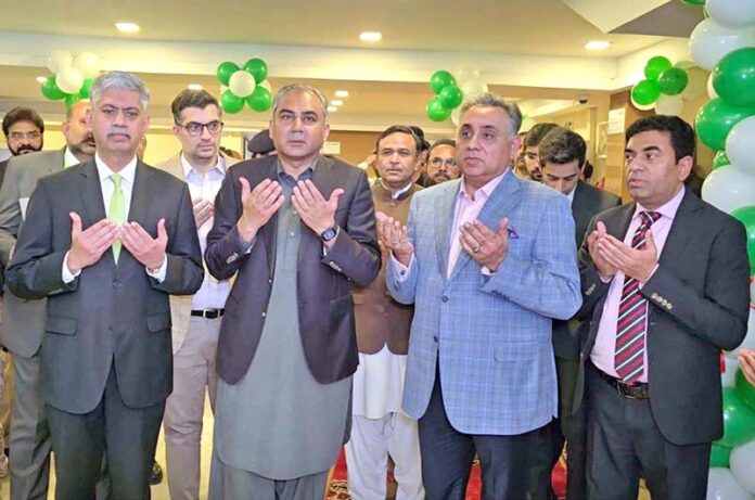 Interior Minister Mohsin Naqvi offering dua during the inauguration ceremony of 24/7 Passport Office at the NADRA Mega Center in Nazimabad