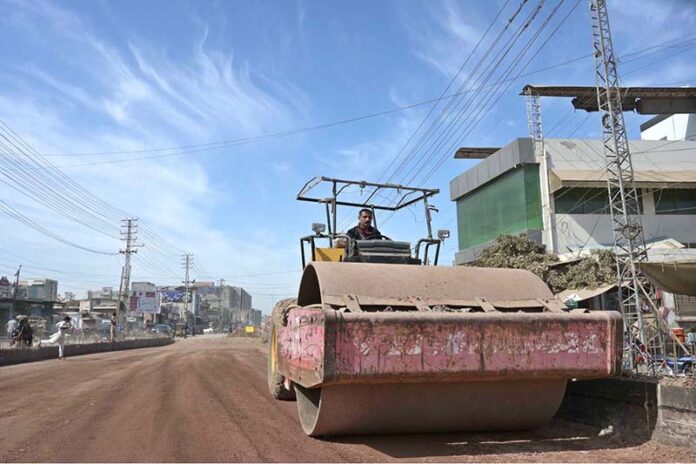 A labourer busy in construction work of flyover at 47 Adda to Qainchi Morr