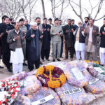 President Asif Ali Zardari offering Fateha at the grave of Major Hamza Israr Shaheed, who embraced martyrdom in North Waziristan