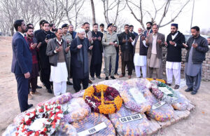 President Asif Ali Zardari offering Fateha at the grave of Major Hamza Israr Shaheed, who embraced martyrdom in North Waziristan