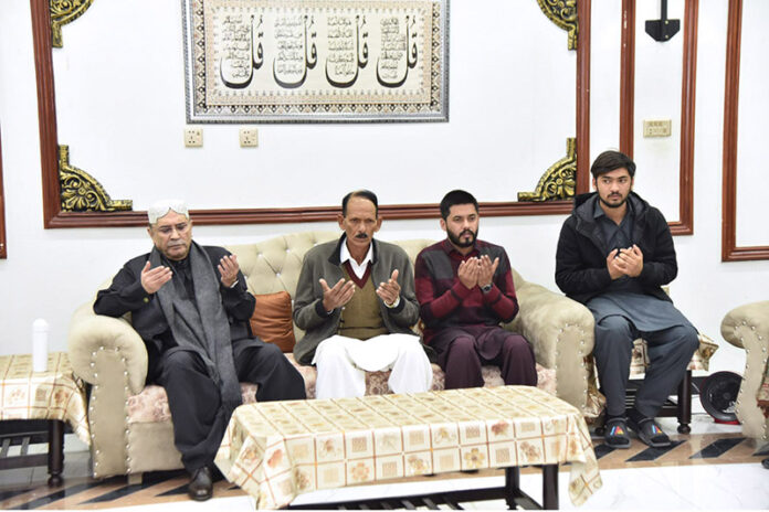 President Asif Ali Zardari offering Fateha for Major Hamza Israr Shaheed, who embraced martyrdom in North Waziristan