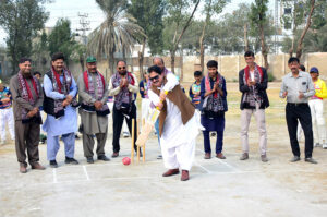 MPA Sabir Qaimkhani hits ball during inauguration ceremony of U-14 League Color Shirt Cricket Championship Trophy at Degree Cricket Ground