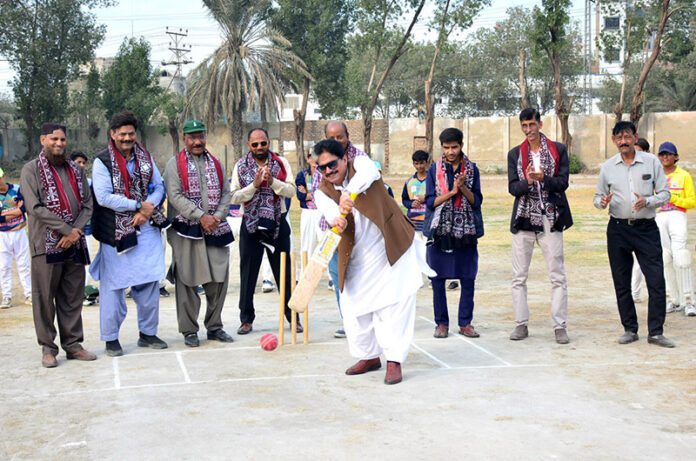 MPA Sabir Qaimkhani hits ball during inauguration ceremony of U-14 League Color Shirt Cricket Championship Trophy at Degree Cricket Ground