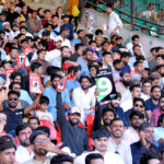 A view of enthusiastic cricket fans crowd through the camera lens during the Tri-Nation Series Final ODI between Pakistan and New Zealand at the National Stadium, Karachi