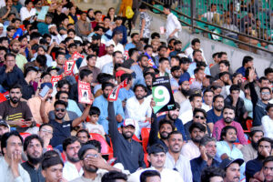 A view of enthusiastic cricket fans crowd through the camera lens during the Tri-Nation Series Final ODI between Pakistan and New Zealand at the National Stadium, Karachi