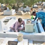 People busy in repair and paint the graves of their relatives at Tando Yousuf Graveyard in connection with Shab-e-Barat