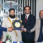 President FCCI, Mr. Rehan Naseem Bharara, presents a shield to Hafiz Muhammad Tahir Mehmood Ashrafi, Special Representative to the Prime Minister of Pakistan for Middle East on Religious Harmony, after his address at an awareness seminar on Hajj at the Faisalabad Chamber of Commerce & Industry (FCCI)