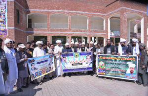 Workers of Bazm Hayat Adab Sargodha Pakistan participating in a walk on the eve of (Almi Maa Boli Dehaar) at Sargodha Arts Council.
