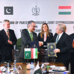 Federal Secretary Economic Affairs, Dr. Kazim Niaz, and Hungarian Deputy Minister for Defence, Tamas Vargha, shaking hand after signing protocols sector