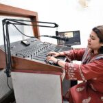 A skilled woman performs at the radio office on World Radio Day