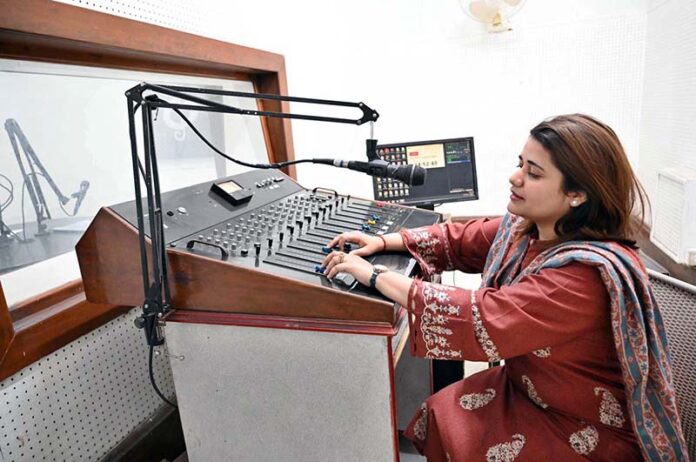 A skilled woman performs at the radio office on World Radio Day