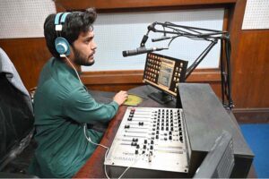 A skilled woman performs at the radio office on World Radio Day