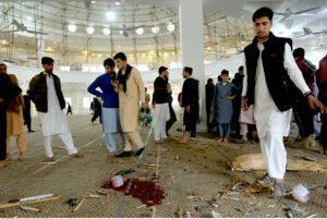 People gather at the blast site at Darul Uloom Haqqania Akora Khattak in which seven people, including Leader of JUI (S) Maulana Hamid Ul Haq Haqqani, were martyred while fifteen others injured.
