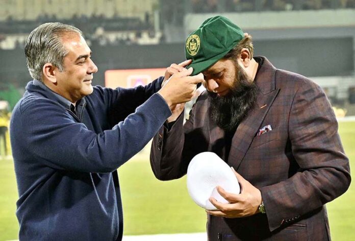 Pakistan Cricket Board (PCB) Chairman Mohsin Naqvi presents the PCB Hall of Fame Cap to former cricket player Inzimam-ul-Haq during first match of Tri-Nation Series played between Pakistan and New Zealand cricket teams at Gaddafi Stadium