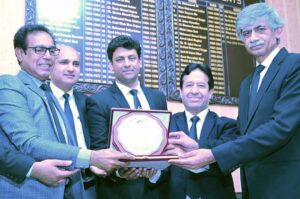 President District Bar Association Irfanullah Warraich Advocate, Secretary Chaudhry Afzal Aslam presenting a shield to renowned national poet Shahid Zaki at the annual Mehfil Mushaira
