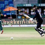New Zealand's Devon Conway watches the ball after playing a shot during the final one-day international (ODI) cricket match of Tri-Nation series between Pakistan and New Zealand at the National Stadium