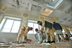 People gather at the blast site at Darul Uloom Haqqania Akora Khattak in which seven people, including Leader of JUI (S) Maulana Hamid Ul Haq Haqqani, were martyred while fifteen others injured.