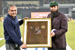 Pakistan Cricket Board (PCB) Chairman Mohsin Naqvi presents the PCB Hall of Fame Cap to former cricket player Inzimam-ul-Haq during first match of Tri-Nation Series played between Pakistan and New Zealand cricket teams at Gaddafi Stadium